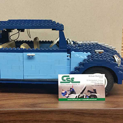 Lego car with shop business card